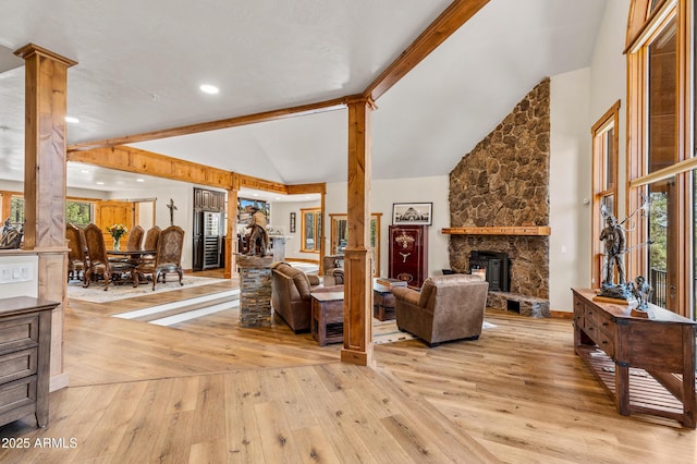 7500 E Old Walnut Canyon Rd, Flagstaff, AZ 86004 - living room with light wood-type flooring, high vaulted ceiling, beamed ceiling, and ornate columns