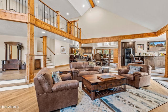 7500 E Old Walnut Canyon Rd, Flagstaff, AZ 86004 - living area featuring stairway, recessed lighting, light wood-type flooring, high vaulted ceiling, and beam ceiling