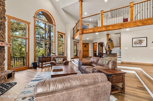 7500 E Old Walnut Canyon Rd, Flagstaff, AZ 86004 - living room featuring hardwood / wood-style floors, stairway, a high ceiling, and recessed lighting