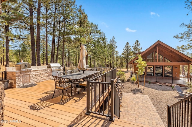 7500 E Old Walnut Canyon Rd, Flagstaff, AZ 86004 - wooden deck with area for grilling and outdoor dining space