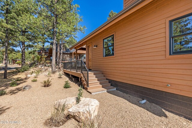 7500 E Old Walnut Canyon Rd, Flagstaff, AZ 86004 - view of side of home featuring a wooden deck and stairway