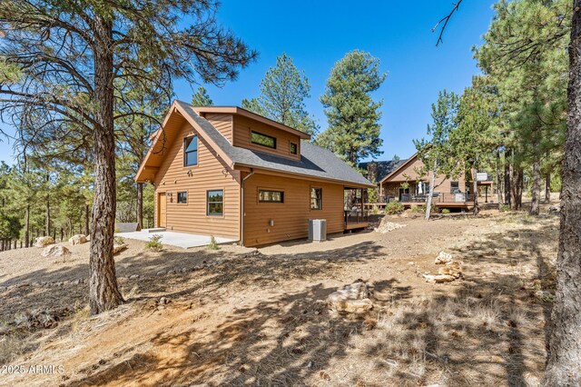 7500 E Old Walnut Canyon Rd, Flagstaff, AZ 86004 - rear view of house with a patio, cooling unit, and a deck