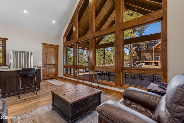 7500 E Old Walnut Canyon Rd, Flagstaff, AZ 86004 - living room featuring plenty of natural light, high vaulted ceiling, and light wood finished floors
