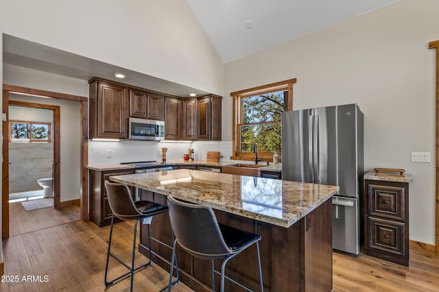 7500 E Old Walnut Canyon Rd, Flagstaff, AZ 86004 - kitchen featuring plenty of natural light, a sink, light wood-style floors, and appliances with stainless steel finishes
