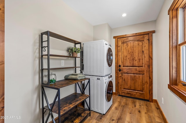 7500 E Old Walnut Canyon Rd, Flagstaff, AZ 86004 - laundry room with stacked washer / dryer, recessed lighting, baseboards, and wood finished floors