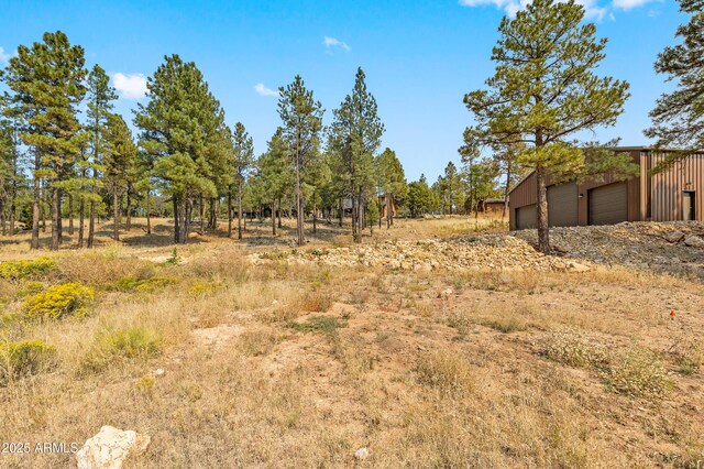 7500 E Old Walnut Canyon Rd, Flagstaff, AZ 86004 - view of yard with an outdoor structure and a garage