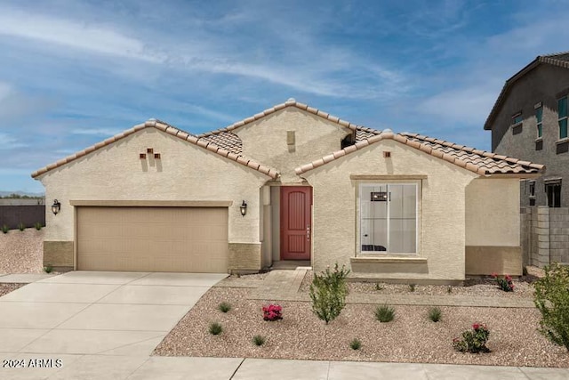 26966 N 168th Ln, Surprise, AZ 85387 - view of front of home featuring concrete driveway, stucco siding, a tiled roof, and a garage