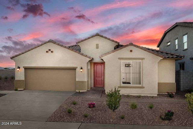 26966 N 168th Ln, Surprise, AZ 85387 - mediterranean / spanish house featuring concrete driveway, a garage, stucco siding, and a tiled roof