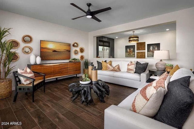 living room with dark wood-type flooring and ceiling fan