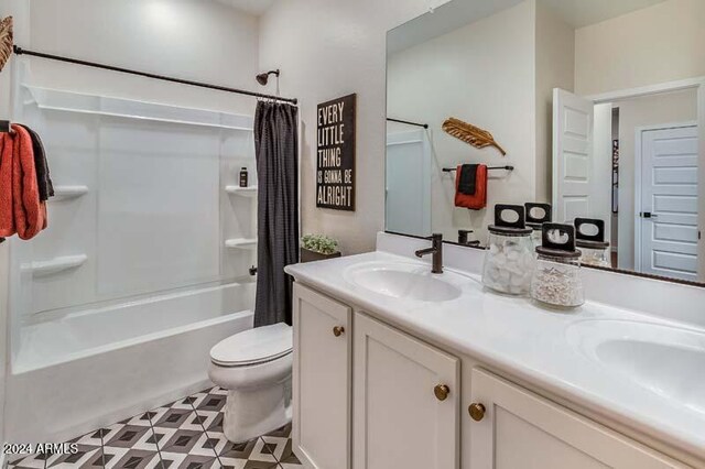 full bathroom featuring toilet, shower / tub combo, vanity, and tile patterned flooring