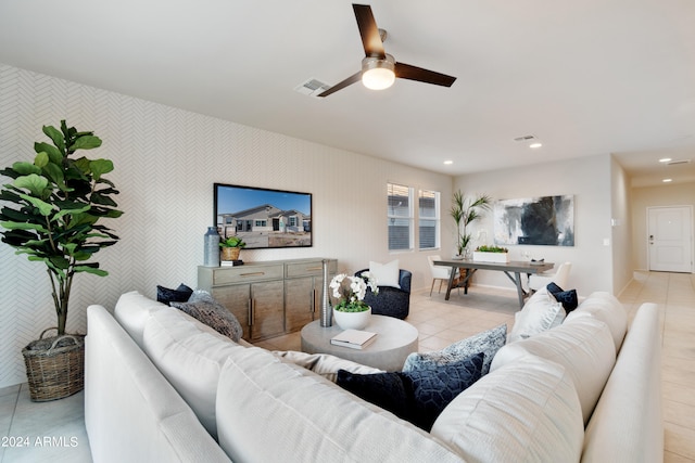 tiled living room with ceiling fan