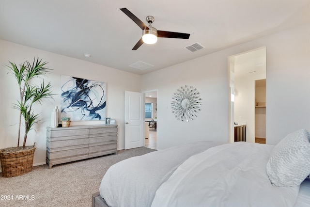 bedroom featuring light carpet and ceiling fan