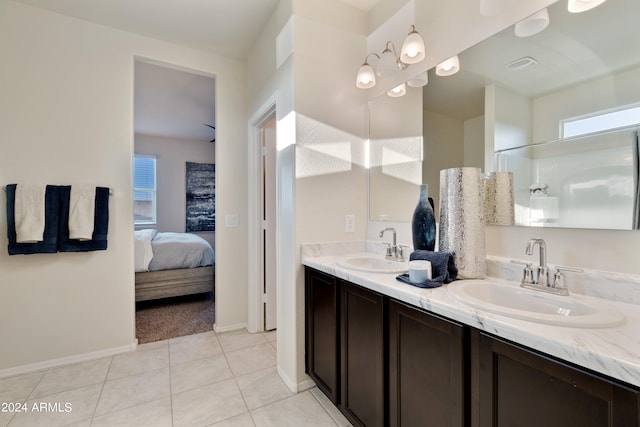 bathroom featuring tile patterned flooring and vanity