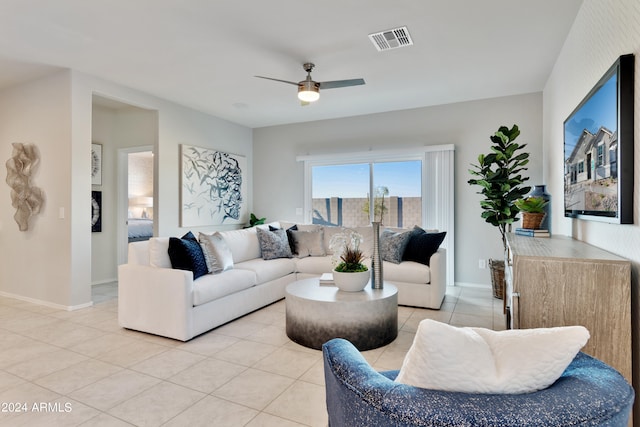 living room featuring ceiling fan and light tile patterned flooring