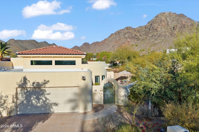 view of front of house featuring a mountain view and a garage