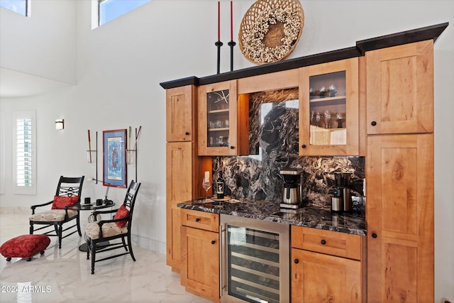 bar with a healthy amount of sunlight, backsplash, wine cooler, and dark stone counters