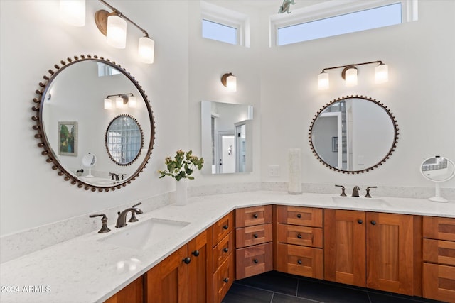 bathroom featuring tile patterned flooring and vanity