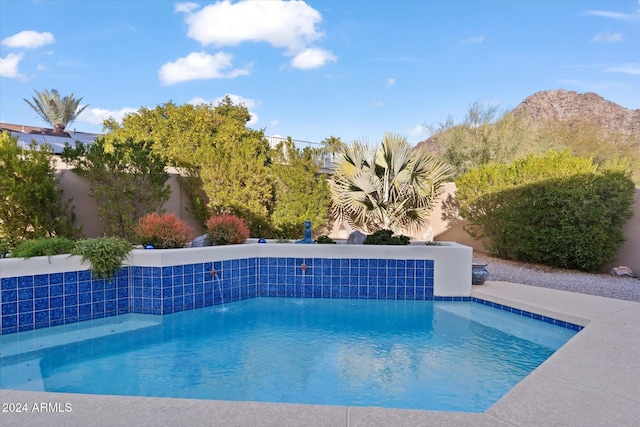 view of pool with a mountain view