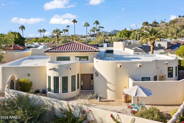 back of house featuring a mountain view