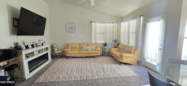 living room with lofted ceiling and carpet flooring