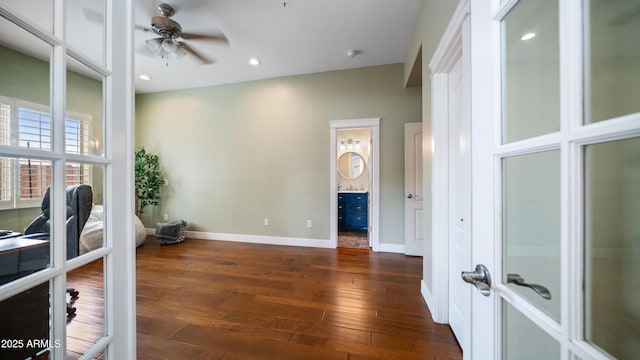 interior space featuring dark wood-type flooring, a ceiling fan, recessed lighting, french doors, and baseboards