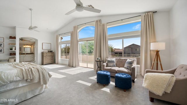 bedroom with visible vents, carpet flooring, arched walkways, ensuite bath, and access to outside