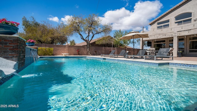 view of swimming pool featuring a fenced in pool, a patio, and fence