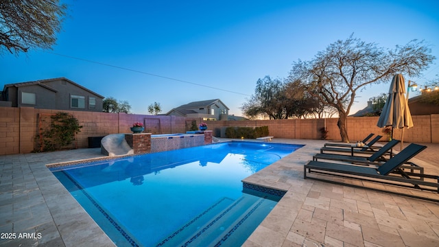 view of swimming pool with a fenced in pool, a patio, and a fenced backyard