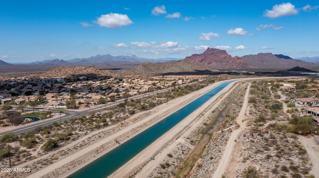 drone / aerial view with a water and mountain view