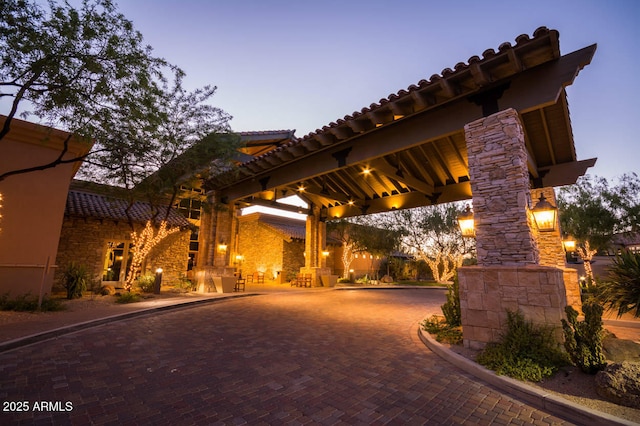 view of patio with a gazebo and decorative driveway