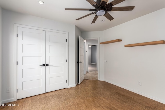 unfurnished bedroom featuring a closet, ceiling fan, and carpet floors