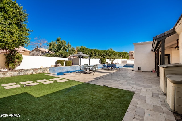 view of yard featuring a gazebo, a patio area, and a fenced in pool