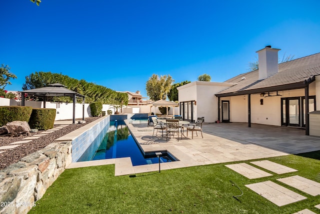 view of pool featuring a lawn, a gazebo, and a patio area