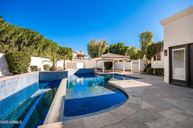 view of pool featuring a patio and a gazebo