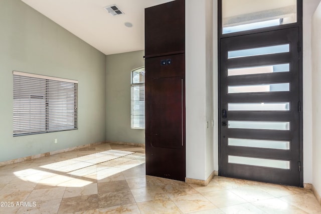 entryway with vaulted ceiling