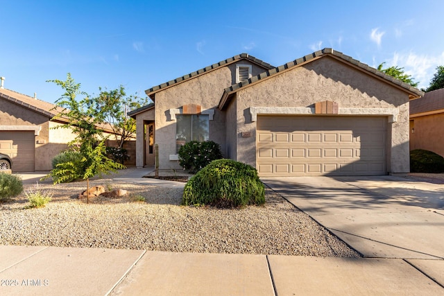 2641 E Binner Dr, Chandler, AZ 85225 - ranch-style house with an attached garage, stucco siding, concrete driveway, and a tiled roof