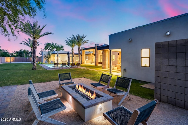 view of patio with fence and an outdoor fire pit