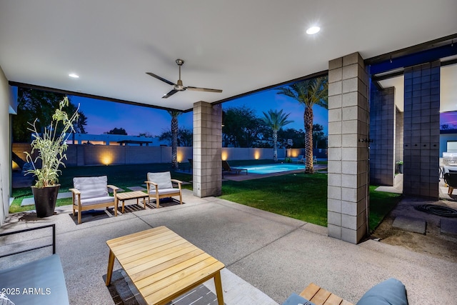 view of patio / terrace featuring a fenced in pool, a ceiling fan, and a fenced backyard