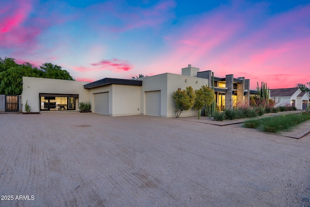 contemporary home featuring stucco siding