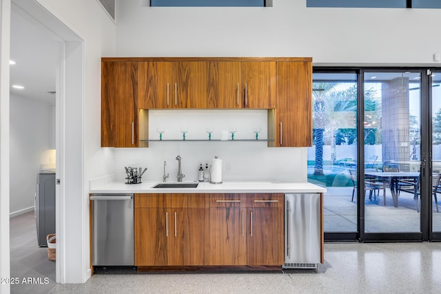 bar with indoor wet bar, a sink, and dishwasher