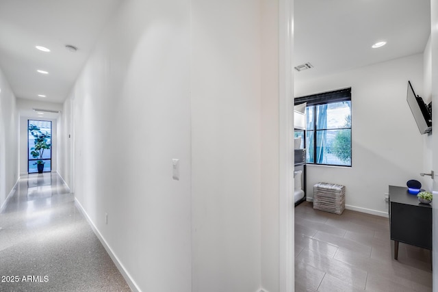 corridor featuring recessed lighting, baseboards, and visible vents
