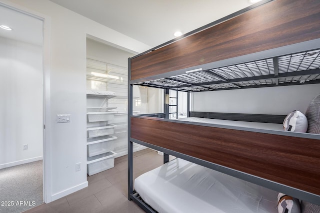 bedroom featuring baseboards