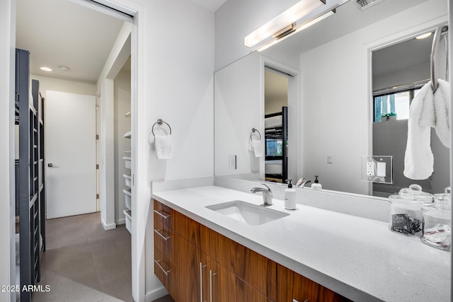 bathroom with vanity, recessed lighting, and tile patterned flooring