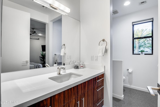ensuite bathroom with baseboards, visible vents, ensuite bathroom, and vanity