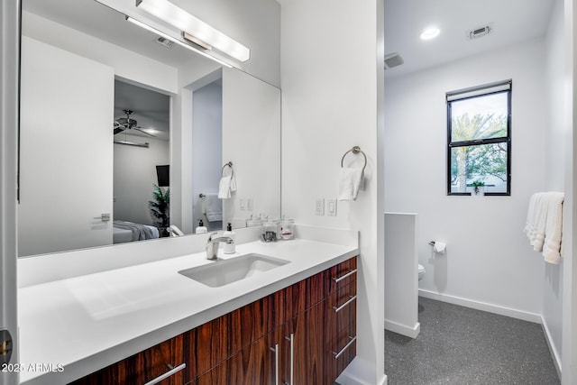 bathroom with ceiling fan, vanity, toilet, baseboards, and visible vents