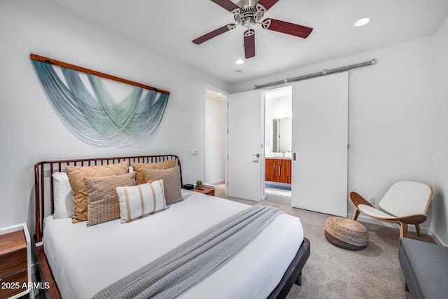 bedroom with recessed lighting, carpet, ensuite bathroom, and baseboards