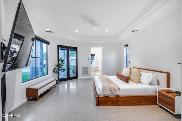 bedroom featuring visible vents, speckled floor, a raised ceiling, access to outside, and recessed lighting