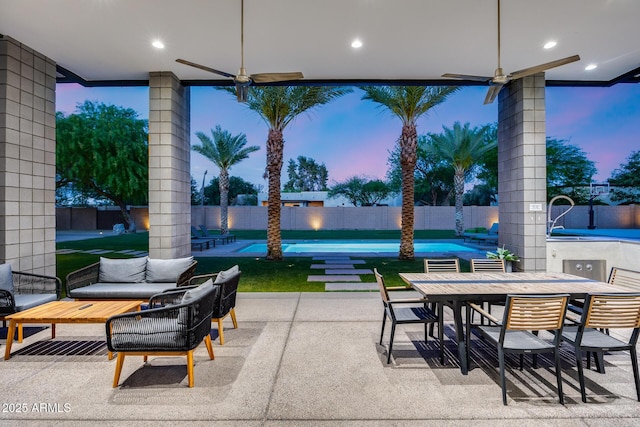 view of patio featuring a fenced in pool, a fenced backyard, and outdoor dining space