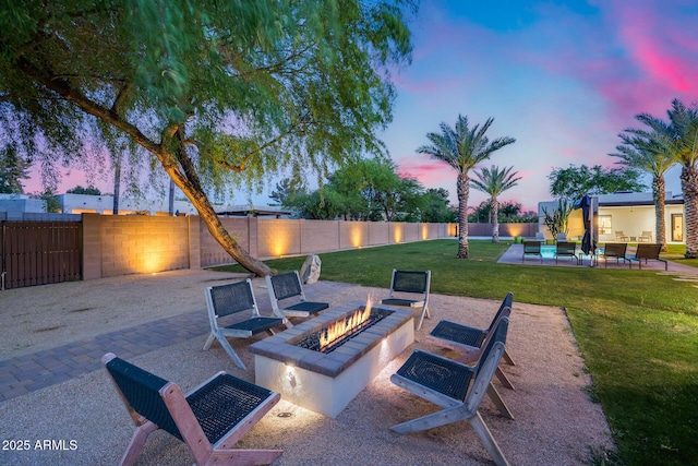 view of patio with fence and an outdoor fire pit