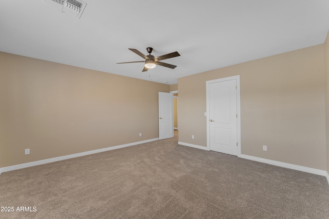 spare room featuring visible vents, a ceiling fan, baseboards, and carpet floors